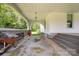 Spacious covered porch perfect for relaxing and enjoying the outdoors at 1637 N College Ave, Newton, NC 28658