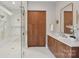 Elegant bathroom featuring a glass shower, vanity with double sinks, and modern cabinetry at 213 Crest Ct, Weddington, NC 28104