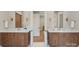 Bathroom featuring double vanity sinks with sleek countertops and a modern design at 213 Crest Ct, Weddington, NC 28104