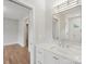 Bathroom featuring a white vanity with marble countertop and a shower with glass door at 213 Crest Ct, Weddington, NC 28104