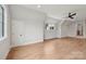 Spacious bonus room with hardwood floors, neutral walls, and ample natural light at 213 Crest Ct, Weddington, NC 28104