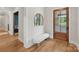 Entryway with a cozy bench, natural light, and hardwood floors; a welcoming start to this home at 213 Crest Ct, Weddington, NC 28104