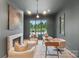 Stylish home office featuring a marble fireplace, modern lighting, and a large window with a scenic view at 213 Crest Ct, Weddington, NC 28104