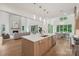 Open kitchen and living space filled with hardwood floors, recessed lighting, and natural light at 213 Crest Ct, Weddington, NC 28104