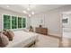 Bright main bedroom with a large window, hardwood floors, and contemporary decor at 213 Crest Ct, Weddington, NC 28104