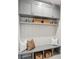 Mudroom with custom built in seating and storage cubbies with overhead shelving at 213 Crest Ct, Weddington, NC 28104