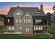Beautiful home showcasing an expansive covered patio, a well-maintained lawn, and timeless style at 213 Crest Ct, Weddington, NC 28104