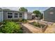 The expansive backyard offers a beautiful flowerbed, patio area, and tranquil views, creating a serene outdoor retreat at 2206 Whitworth Rd, Cherryville, NC 28021