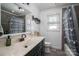 This well-lit bathroom boasts a spacious sink, tiled walls, and a modern design, offering a refreshing and functional space at 2206 Whitworth Rd, Cherryville, NC 28021