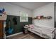 This cozy bedroom includes shelving, natural light, and ample space for creative expression and restful nights at 2206 Whitworth Rd, Cherryville, NC 28021