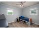A serene bedroom with hardwood floors features a ceiling fan and natural light, perfect for relaxation and comfort at 2206 Whitworth Rd, Cherryville, NC 28021