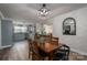 A charming dining area features hardwood floors and a stylish light fixture, creating an inviting atmosphere for meals at 2206 Whitworth Rd, Cherryville, NC 28021
