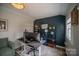 Functional home office with dark accent wall, modern desk, and cozy decor to encourage productivity at 2206 Whitworth Rd, Cherryville, NC 28021