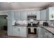 Charming kitchen featuring updated appliances, backsplash and ample cabinet space, perfect for preparing culinary delights at 2206 Whitworth Rd, Cherryville, NC 28021