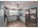 Spacious kitchen with granite countertops, modern backsplash, stainless steel appliances, and plentiful storage at 2206 Whitworth Rd, Cherryville, NC 28021