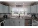Bright kitchen boasts updated appliances, granite counters, and a modern backsplash for cooking and entertaining at 2206 Whitworth Rd, Cherryville, NC 28021