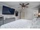 Spacious bedroom with a ceiling fan, TV, neutral colors, and a serene atmosphere promoting relaxation at 2206 Whitworth Rd, Cherryville, NC 28021