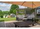 Outdoor patio with a pergola, cozy seating, and a table, perfect for entertaining in style at 2206 Whitworth Rd, Cherryville, NC 28021