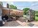 Enjoy the cozy outdoor patio featuring a pergola, comfortable seating, and an umbrella for sunny days at 2206 Whitworth Rd, Cherryville, NC 28021
