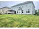 A spacious backyard features a well-maintained lawn and an outdoor seating area with a gazebo at 2634 Treeline Dr, Concord, NC 28027