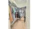 Walk-in closet with an abundance of hanging clothes neatly organized on wire shelving at 2634 Treeline Dr, Concord, NC 28027