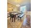 Formal dining room featuring dark wood floors, elegant furniture, and plenty of natural light at 2634 Treeline Dr, Concord, NC 28027