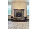 Cozy stone fireplace with mantle as a focal point and beautiful area rug at 2634 Treeline Dr, Concord, NC 28027