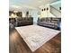 Spacious living room featuring hardwood floors, two couches, and an open floor plan at 2634 Treeline Dr, Concord, NC 28027