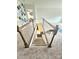 Carpeted stairway features white railings and wood banisters, leading to the lower level of the home at 2634 Treeline Dr, Concord, NC 28027