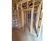 Under construction bathroom features wood framing, shower, and visible plumbing at 2735 Primrose Ave, Charlotte, NC 28208