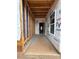 Unfinished entryway with concrete flooring, stud framing, and doorway to additional spaces at 2735 Primrose Ave, Charlotte, NC 28208
