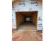 Spacious unfinished two car garage with concrete floor and room for storage and vehicles at 2735 Primrose Ave, Charlotte, NC 28208