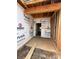Unfinished garage interior with concrete floor, exposed studs, and Tyvek house wrap at 2735 Primrose Ave, Charlotte, NC 28208