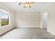 Bedroom with carpet, ceiling fan and large window with plenty of natural light at 2765 Clover Nw Rd, Concord, NC 28027