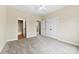 Cozy bedroom featuring plush carpeting, en-suite bathroom, and a spacious closet at 2765 Clover Nw Rd, Concord, NC 28027