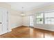 Dining room features wood floors, backyard view, and traditional chandelier at 2765 Clover Nw Rd, Concord, NC 28027