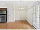Open dining area features hardwood floors, bright natural light, and access to a patio at 2765 Clover Nw Rd, Concord, NC 28027