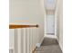 Upstairs hallway with carpet and white trim, leading to the bedrooms at 2765 Clover Nw Rd, Concord, NC 28027