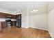 Well-lit kitchen with stainless steel appliances, and wood floors at 2765 Clover Nw Rd, Concord, NC 28027