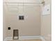 A dedicated laundry room with utility connections, shelves, and storage for household chores at 2765 Clover Nw Rd, Concord, NC 28027