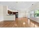 The open-concept kitchen and dining areas feature hardwood floors and lots of natural light at 2765 Clover Nw Rd, Concord, NC 28027