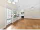 Living room boasts a fireplace, hardwood flooring and large windows with natural light at 2765 Clover Nw Rd, Concord, NC 28027