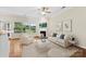 Bright living room with large windows, a fireplace, and stylish modern decor at 2765 Clover Nw Rd, Concord, NC 28027