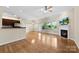 Bright living room boasts a fireplace, lots of natural light, and hardwood flooring at 2765 Clover Nw Rd, Concord, NC 28027