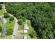 An aerial view showcasing the home's roof and verdant surroundings, highlighting its private location near lush greenery at 3269 Tolley St, Claremont, NC 28610