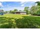 Inviting backyard with a spacious lawn, lovely home, and covered parking at 3269 Tolley St, Claremont, NC 28610