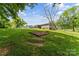 Spacious, partially wooded backyard showing gardening space and plenty of room to enjoy the outdoors at 3269 Tolley St, Claremont, NC 28610