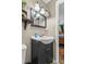 Cozy bathroom features a modern vanity, a framed mirror, and decorative light fixtures at 3269 Tolley St, Claremont, NC 28610