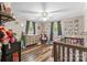 Bright bedroom with a ceiling fan, two windows with curtains, and lots of storage at 3269 Tolley St, Claremont, NC 28610
