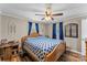 Comfortable bedroom with hardwood floors, a ceiling fan, and bright natural light at 3269 Tolley St, Claremont, NC 28610